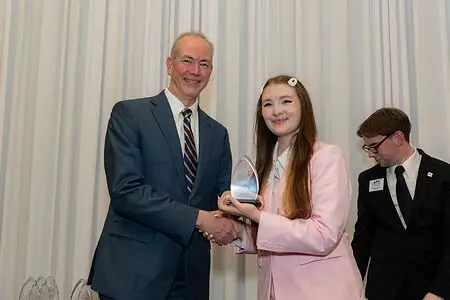 Accepting my awards for being one of the top 20 College of Business Students at the University of Alabama in Huntsville. I am pictured with the Dean of the College of Business, Dr. Jason Greene.